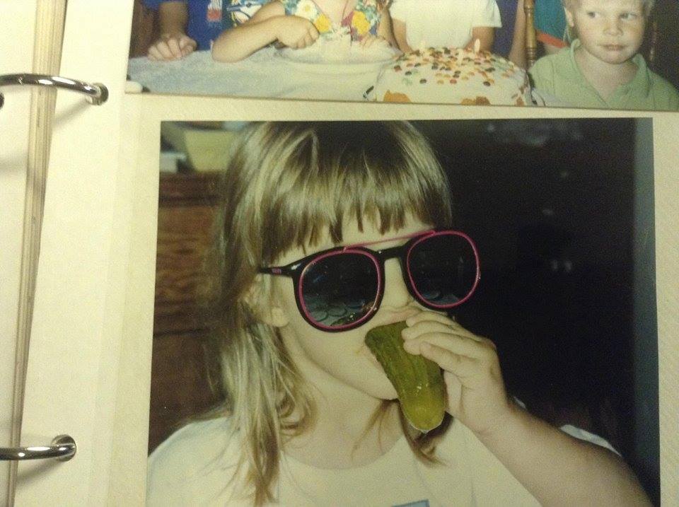 Young Alexis eating pickles