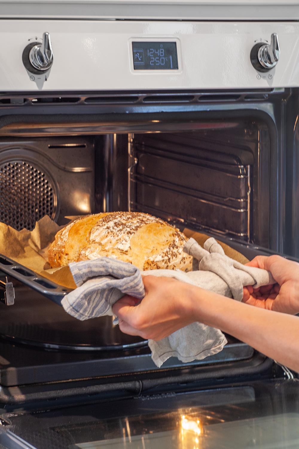 sourdough bread coming out of oven