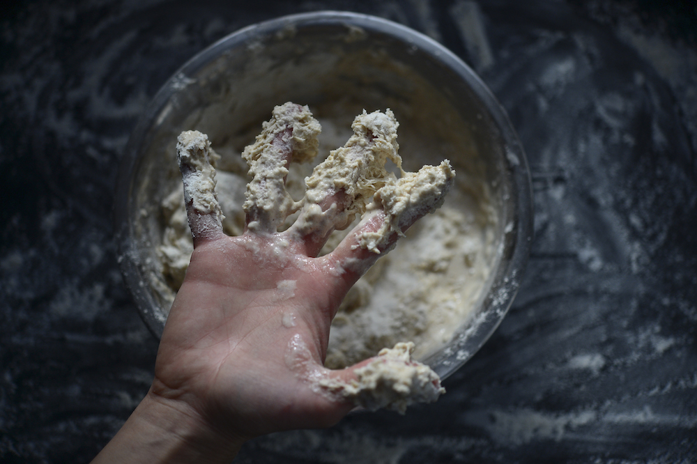 sourdough on hands